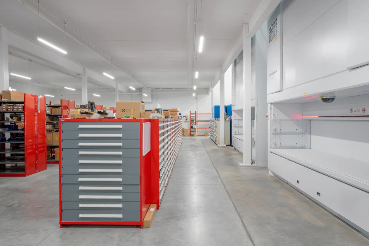 Housby Mack parts storage with vertical lift equipment and LED lighting.