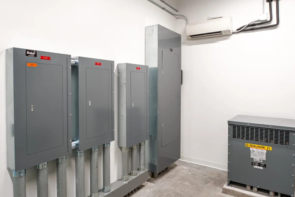 Electrical panels, transformer, and room cooling equipment.